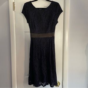 Beautiful black and blue floral lace overlay tie waist dress. Deep V Back lined